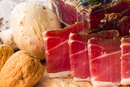 Tasty slices of Italian speck with rosemaryの写真素材