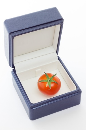 A tomato gift from nature with white background の写真素材