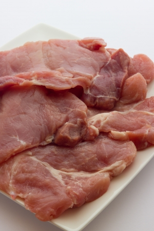 A close up view of same pork steaksの写真素材