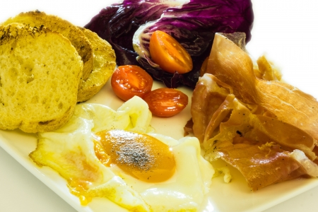 Cose up view of fried eggs with baconの写真素材