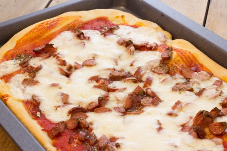 Home made pizza just pulled out of the ovenの写真素材