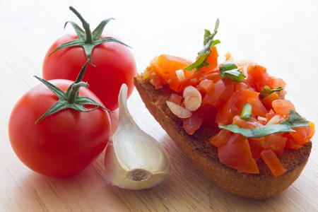 Close up view of bruschetta and ingredientsの写真素材