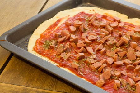 Home made pizza ready to be bakedの写真素材