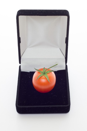A tomato gift from nature with white background の写真素材