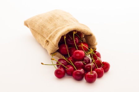 Ripe red cherry berries with white backgroundの写真素材