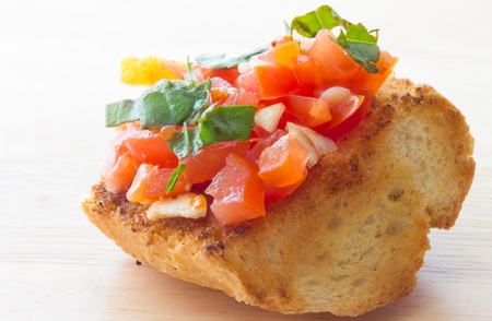 Close up view of bruschetta and ingredientsの写真素材