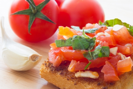 Close up view of bruschetta and ingredientsの写真素材