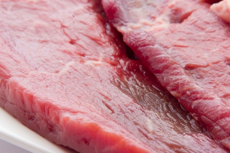 Close up view of same veal steaksの写真素材