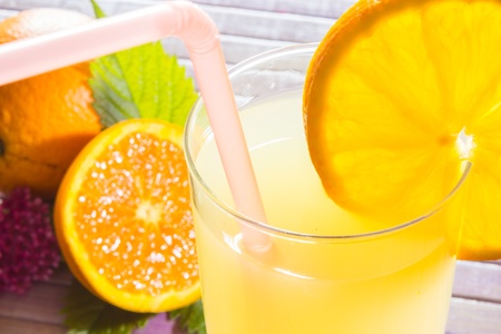 Fresh and colorful orange juice in a glassの写真素材