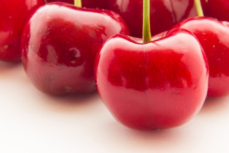 Ripe red cherry berries with white backgroundの写真素材