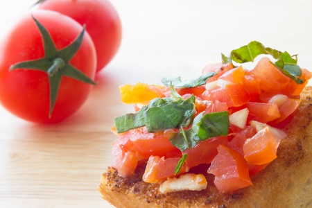 Close up view of bruschetta and ingredientsの写真素材