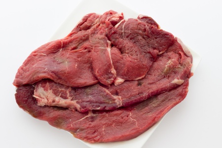 Close up view of same veal steaksの写真素材