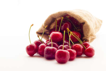 Ripe red cherry berries with white backgroundの写真素材