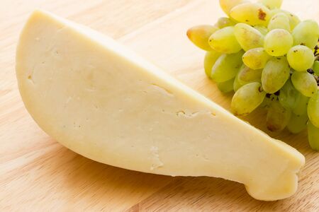 Slice of scamorza cheese from Italyの写真素材