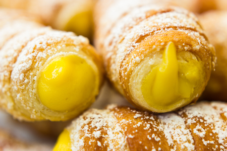 Italian cannoli filled with egg creamの写真素材