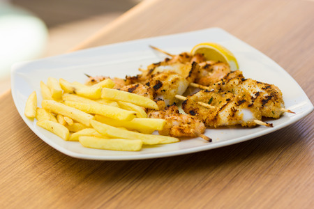 skewers of grilled squid and shrimpの写真素材