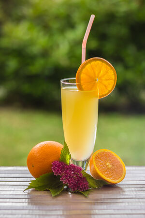 Fresh and colorful orange juice in a glassの写真素材