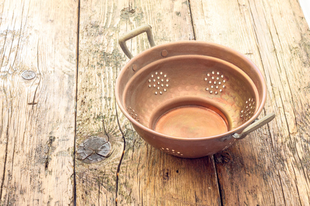 old copper colanderの写真素材