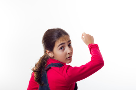 Girl writes on the blackboardの写真素材