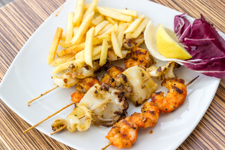 Grilled cuttlefish with friesの写真素材