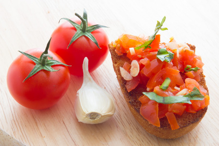 Close up view of bruschetta and ingredientsの写真素材