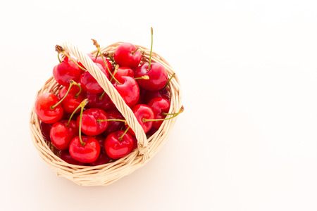 Ripe red cherry berries with white backgroundの写真素材