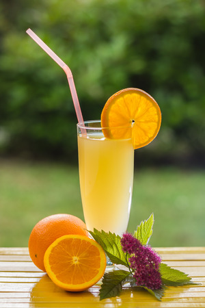 Fresh and colorful orange juice in a glassの写真素材