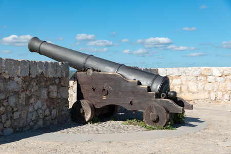 Ancient bronze cannon in Ibizaの写真素材