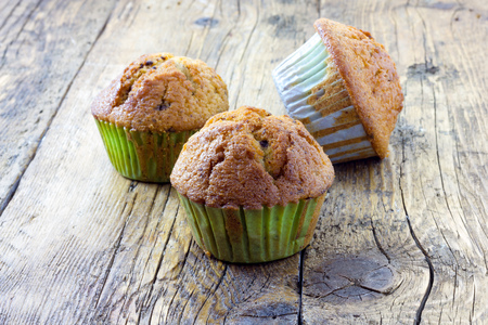 Muffins on a wooden tableの写真素材