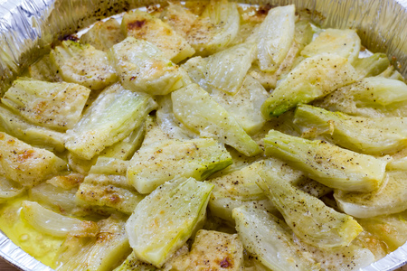 Fennel cooked in a pan with cheeseの写真素材