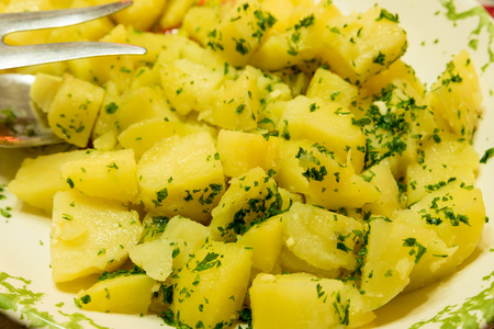 Side dish of boiled potatoes with parsleyの写真素材