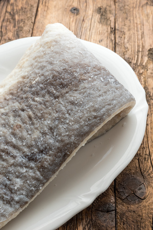 Slice of raw salted codfish