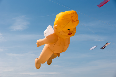 Kites with blue sky and white cloudsの写真素材