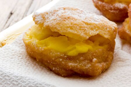 Handmade krapfen filled with pastry creamの写真素材