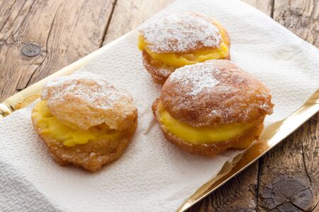 Handmade krapfen filled with pastry creamの写真素材