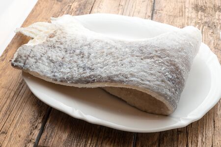 Slice of raw salted codfish