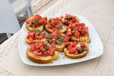 Appetizer of bruschetta with tuna