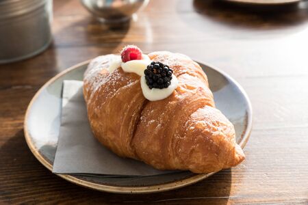 Croissant with cream of mascarpone and berries