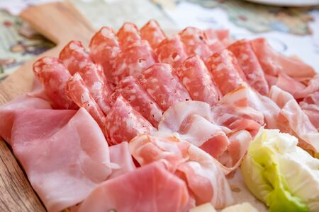 Mortadella salami with bacon and cheeseの写真素材