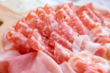 Mortadella salami with bacon and cheeseの写真素材