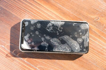 Smartphone with broken glassの写真素材