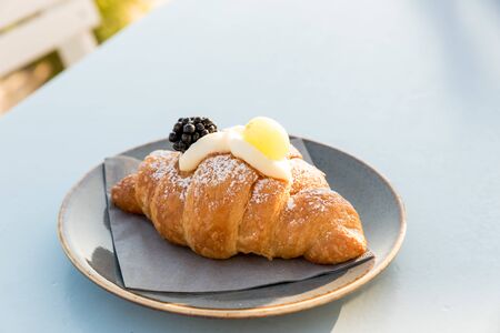 Creamy croissant with berriesの写真素材