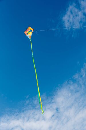 Kites with blue sky and white cloudsの写真素材