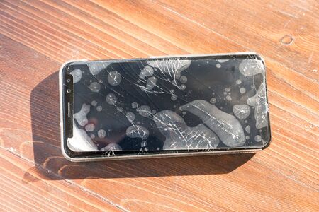 Smartphone with broken glassの写真素材