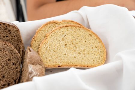 Basket with black and white breadの写真素材