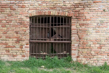 Iron door with rusty barsの写真素材