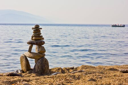 Stone tower on the beach in greeceの写真素材