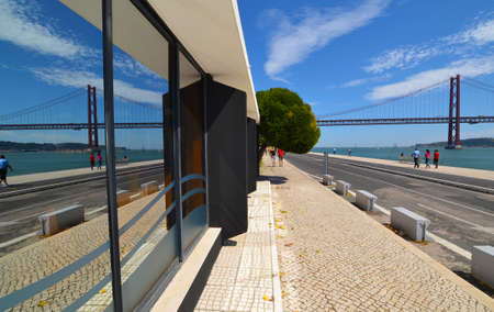 reflection of bridge in building on sunny afternoon
