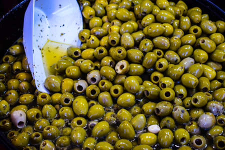 Delicious big green olives on the medieval marketの写真素材