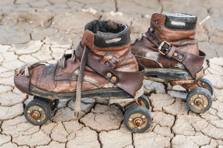 Old and worn and rusty rolllers in the dirtの写真素材